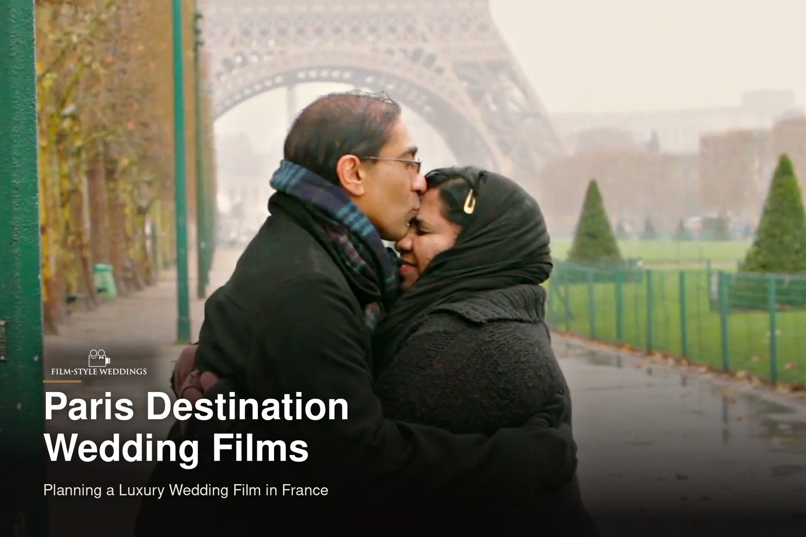 Paris destination wedding guide cover: a couple embracing near the Eiffel Tower, from our concept film Remembering Paris