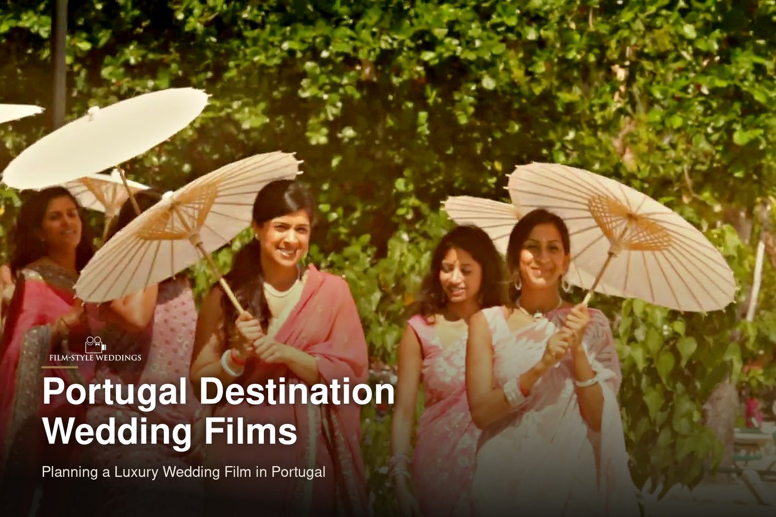 Portugal destination wedding guide cover: bridesmaids carrying white parasols through a garden, from our destination wedding film in Jamaica