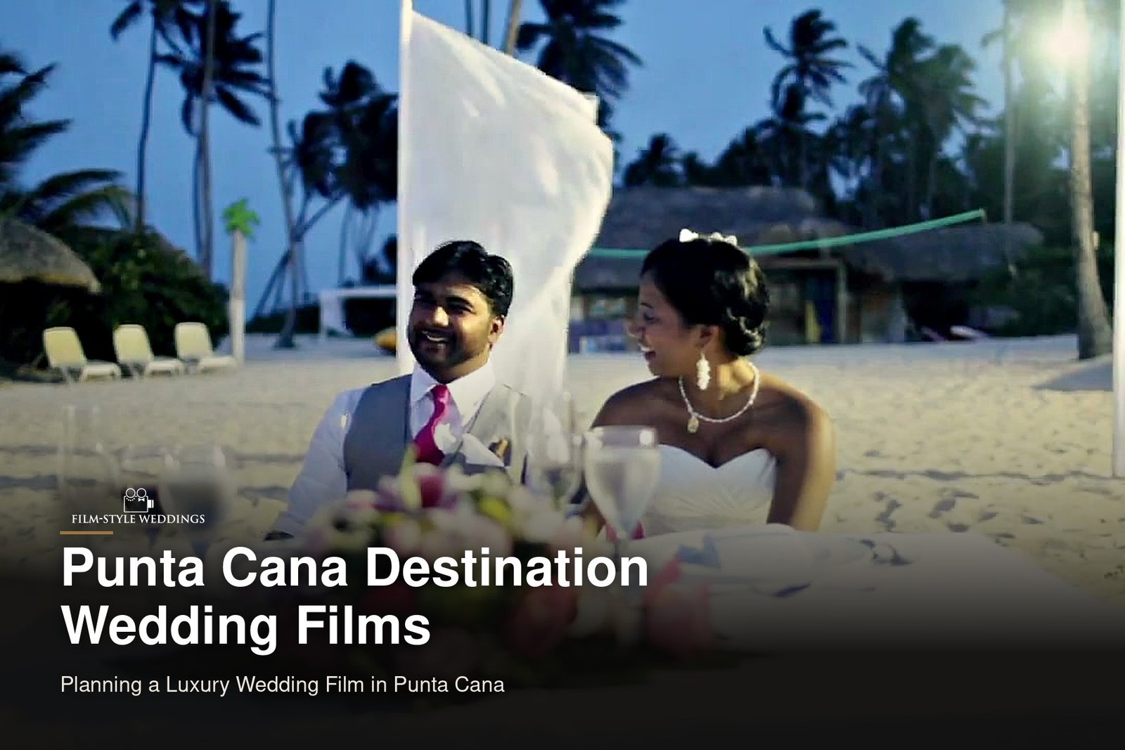 Punta Cana destination wedding guide cover: a bride and groom at their sweetheart table on the beach, from our destination wedding film in Punta Cana