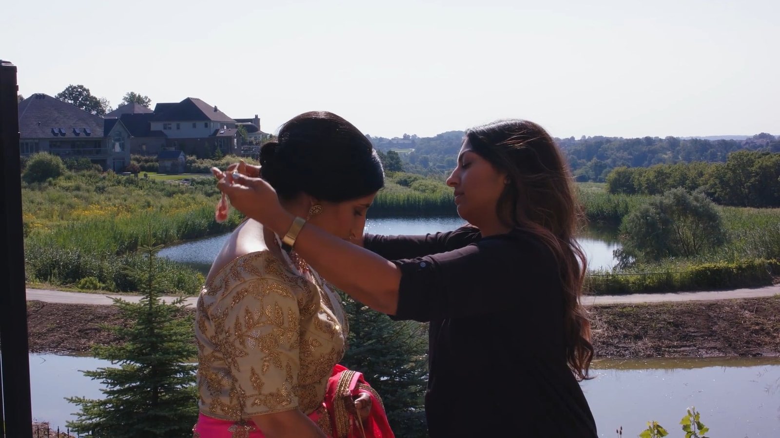 Luxury wedding videographer Dubai guide: Poonam getting ready with help from family in Poonam and Tarak's wedding film