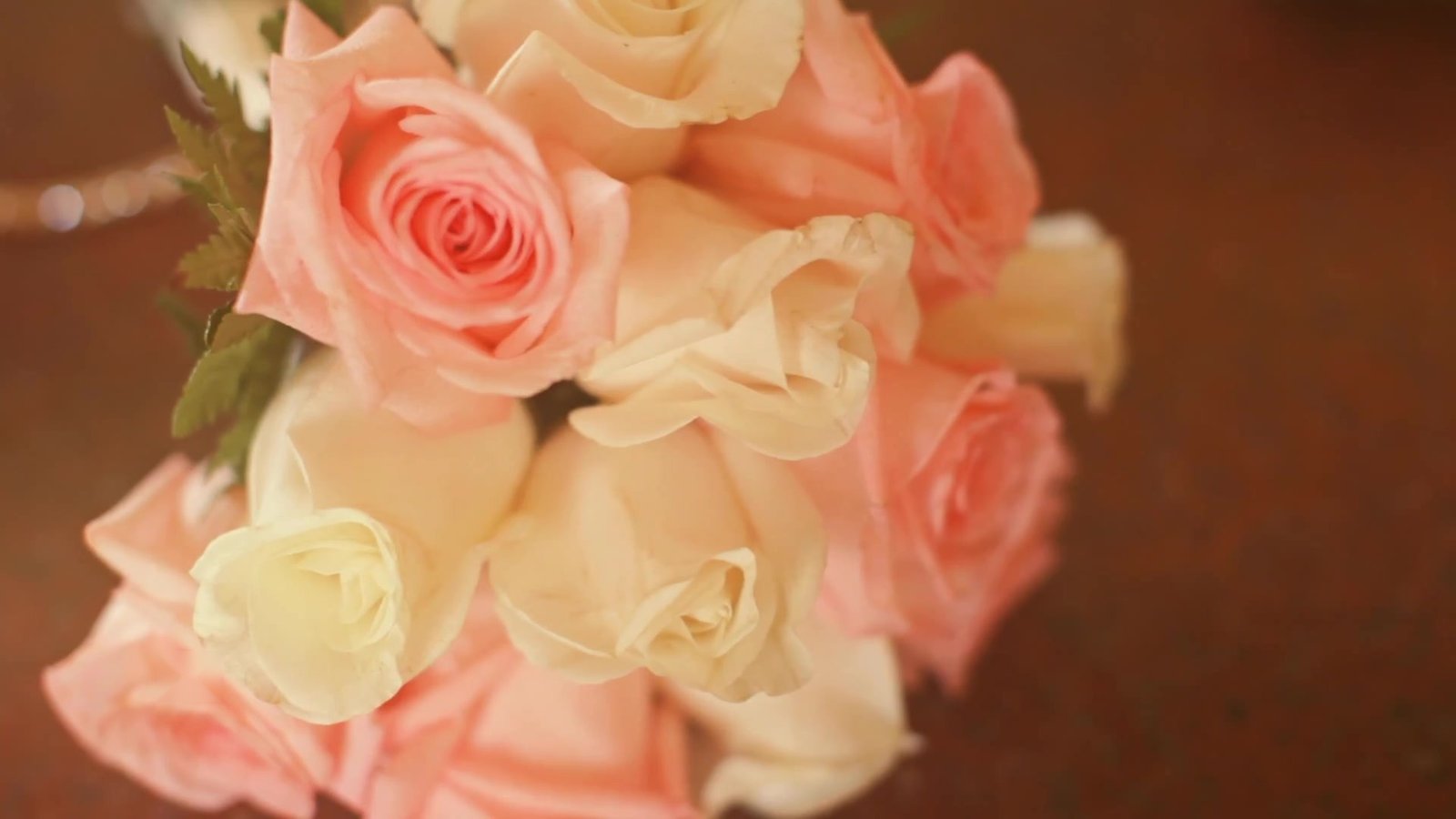 Jamaica destination wedding film still: the bride's bouquet of blush and ivory roses, from our destination wedding film in Jamaica