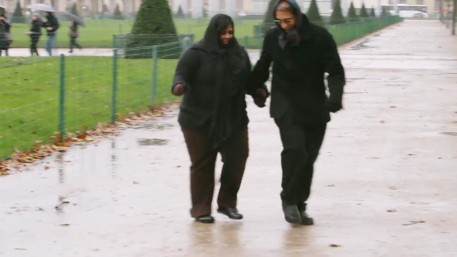 Paris destination wedding film inspiration: a couple walking hand in hand on the Champ de Mars, from our concept film Remembering Paris