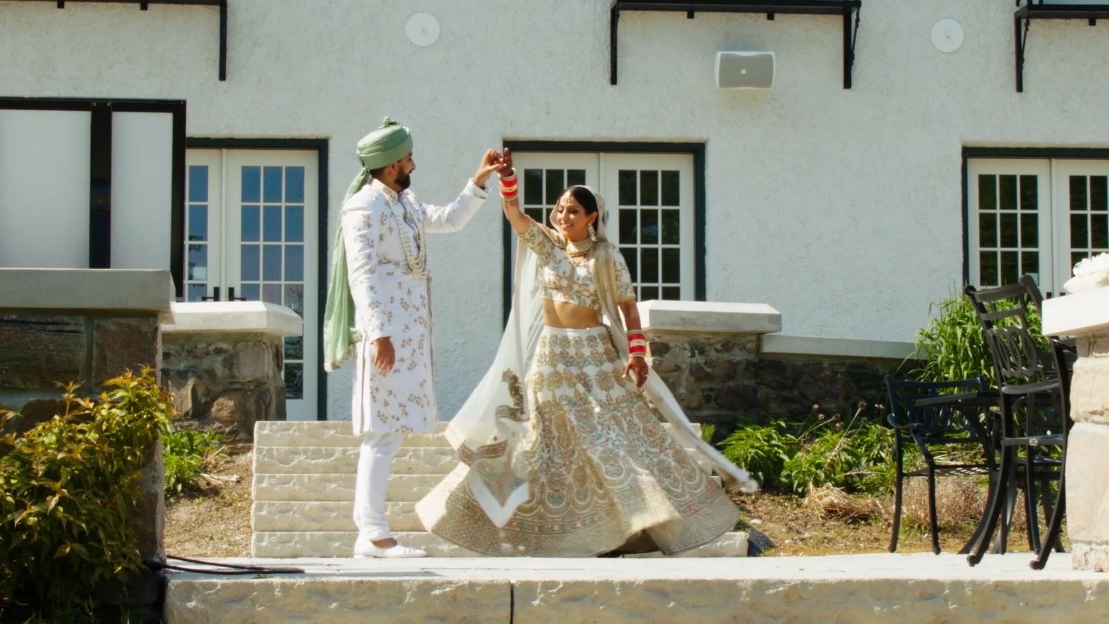 Same day edit wedding film still of Shelley and Mayur dancing on the terrace on their wedding day