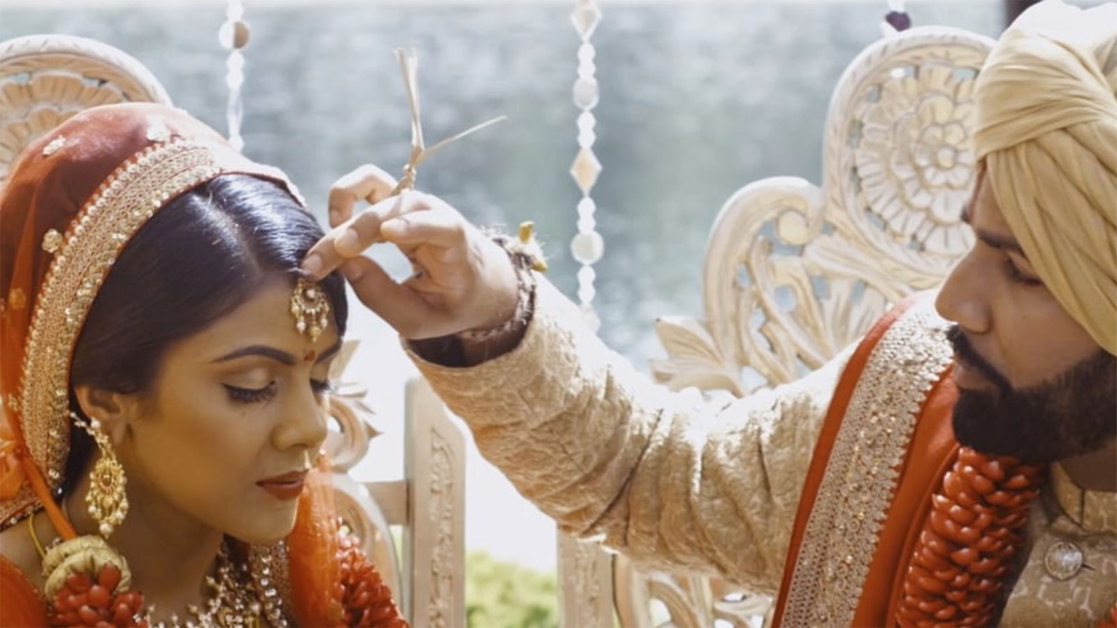 A bride receives a blessing during the ceremony